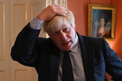 (FILES) In this file photo taken on September 03, 2019 Britain's Prime Minister Boris Johnson reacts as he greets NHS workers as they take afternoon tea inside 10 Downing Street in central London. Preparedness in Britain for a no-deal Brexit remains "at a low level", with logjams at Channel ports threatening to impact drug and food supplies, according to government assessments released September 11, 2019. Britain's plan for no checks at the Irish border would likely "prove unsustainable due to significant economic, legal and biosecurity risks", it said, adding that it could lead to a black market developing in border communities, with dissident groups expected to capitalise. Gibraltar could be particularly badly affected, it said, due to the imposition of checks at its border with Spain. / AFP / DANIEL LEAL-OLIVAS
