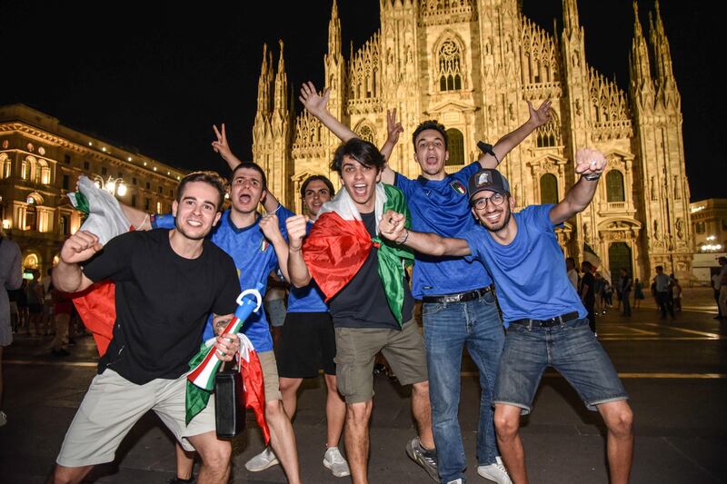 Italy fans celebrate their team's victory in the Euro 2020 semi-final against Spain in Milan, Italy.