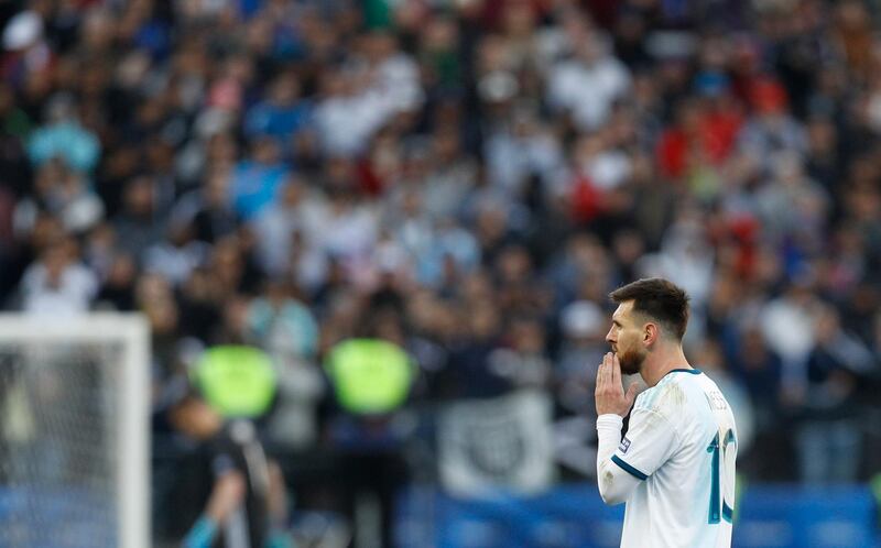 Messi leaves the field after being sent off. AP Photo