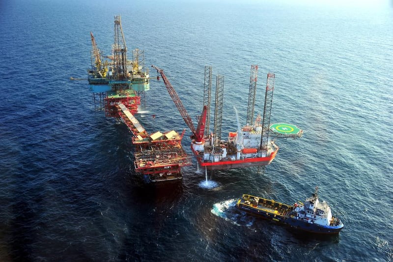 Oil platforms at Abu Dhabi’s offshore Nasr Field. The emirate's growth weakened this year due to its compliance to a global oil production cut. Wam