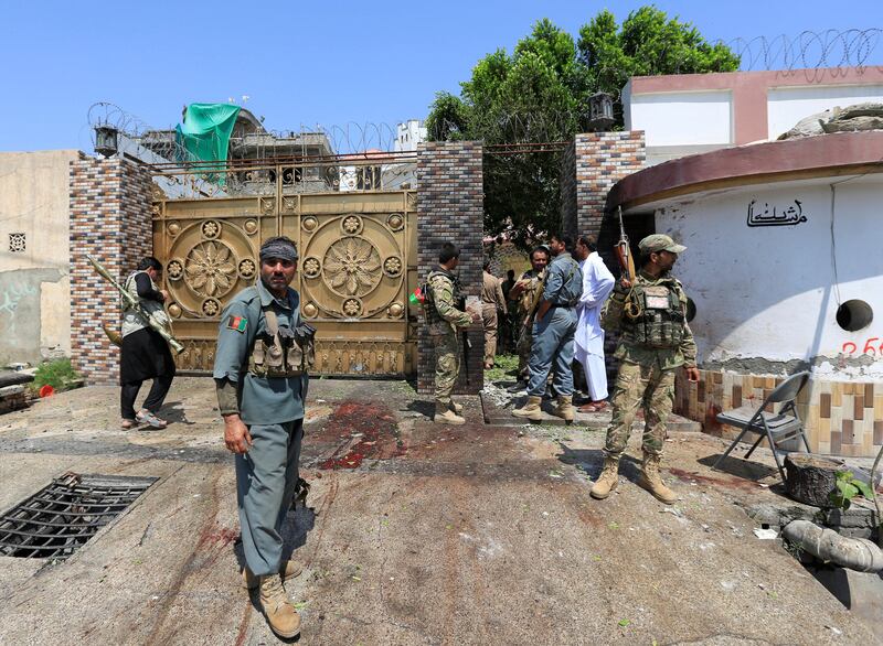 ATTENTION EDITORS - VISUAL COVERAGE OF SCENES OF INJURY OR DEATH    Afghan security force stand at the site of a suicide attack in Jalalabad city, Afghanistan August 30, 2017. REUTERS/Parwiz   TEMPLATE OUT