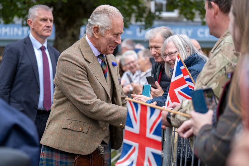 The Union flags are broken out as King Charles meets locals in Tomintoul. Getty Images