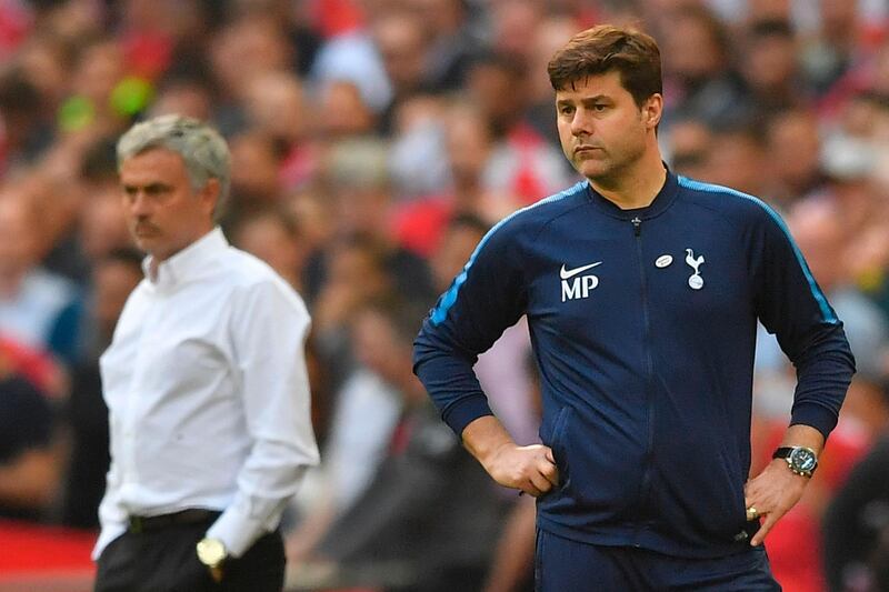 Manchester United's Portuguese manager Jose Mourinho (L) and Tottenham Hotspur's  head coach Mauricio Pochettino look on during the FA Cup semi-final at Wembley in 2018. Mourinho replaced Pochettino as Spurs manager after the Argentine was sacked. AFP