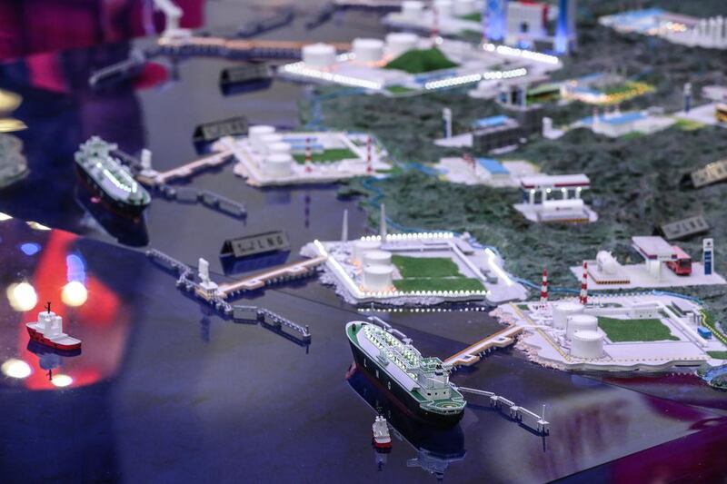 Models of oil rigs and platform layouts displayed at the exhibition stand of the China National Offshore Oil Corporation at the 21st World Petroleum Congress in Moscow. Sergei Ilnitsky / EPA
