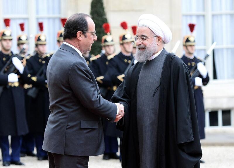 French president Francois Hollande with his Iranian counterpart, Hassan Rouhani,at the Elysee Presidential Palace in Paris. Stephane de Sakutin / AFP