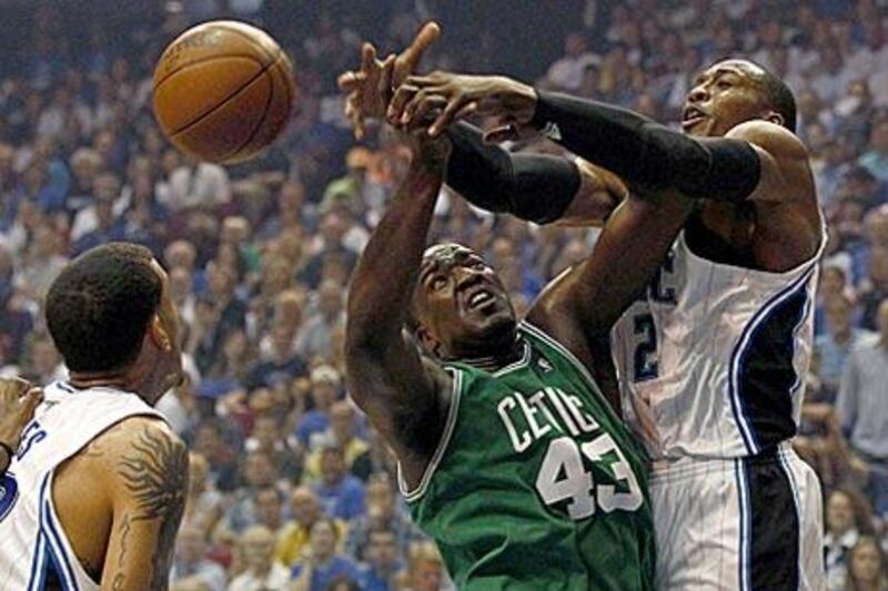 Dwight Howard, right, and Kendrick Perkins battle for a rebound in Game 1.