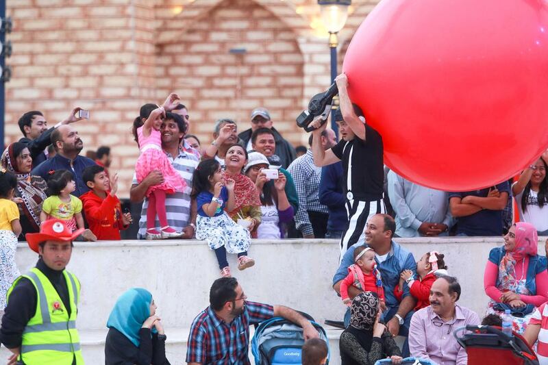 Otto Bas Sotto from Italy amazes the crowd with his giant red balloon. Victor Besa for The National