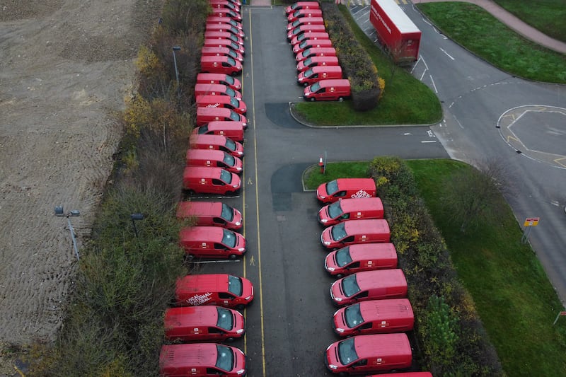 Postal delivery vans are parked as Royal Mail workers strike, in Leeds. EPA