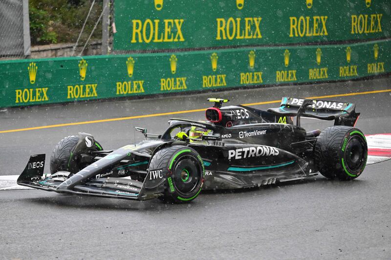 Mercedes driver Lewis Hamilton drives in the rain during the Monaco GP. AFP