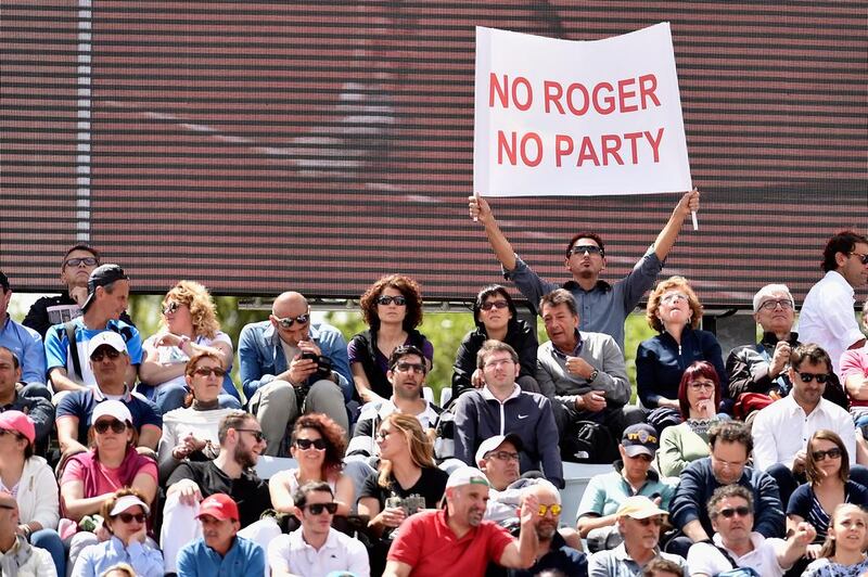 A Roger Federer supporter shows a banner during his match at the Italian Open. Dennis Grombkowski / Getty Images