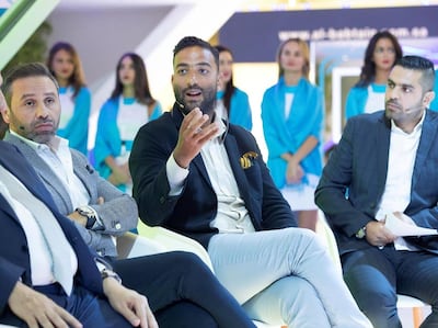 Hazem Emam, left, alongside Mido, centre, at the launch of the Du Football Champions in Dubai. Antonie Robertson / The National