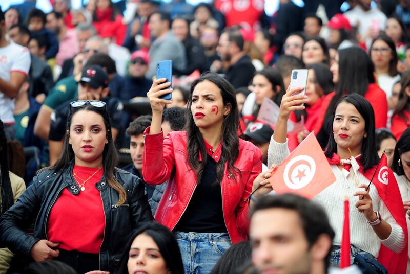 Tunisia soccer fans gather to watch their national team play against Denmark in a World Cup soccer match played in Qatar, on a large screen set up for fans in Tunis, Tunisia, Tuesday, Nov.  22, 2022.  (AP Photo / Hassene Dridi)