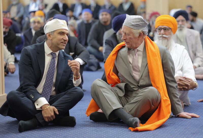 King Charles III in the Prayer Hall with Prof Gurch Randhawa, a member of the Sikh congregation, on a visit to the newly built Guru Nanak Gurdwara in Luton on Tuesday. PA