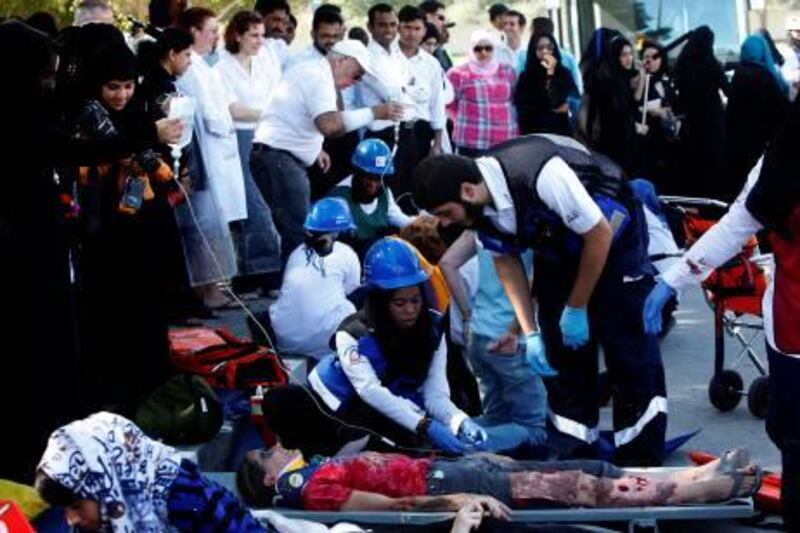 Dubai , United Arab Emirates- March , 1 4, 2011:    Dubai Womens College organised the seventh Mass Casualty Incident Simulation as the aftermath of an airplane crash at the campus   in  Dubai .  ( Satish Kumar / The National )
