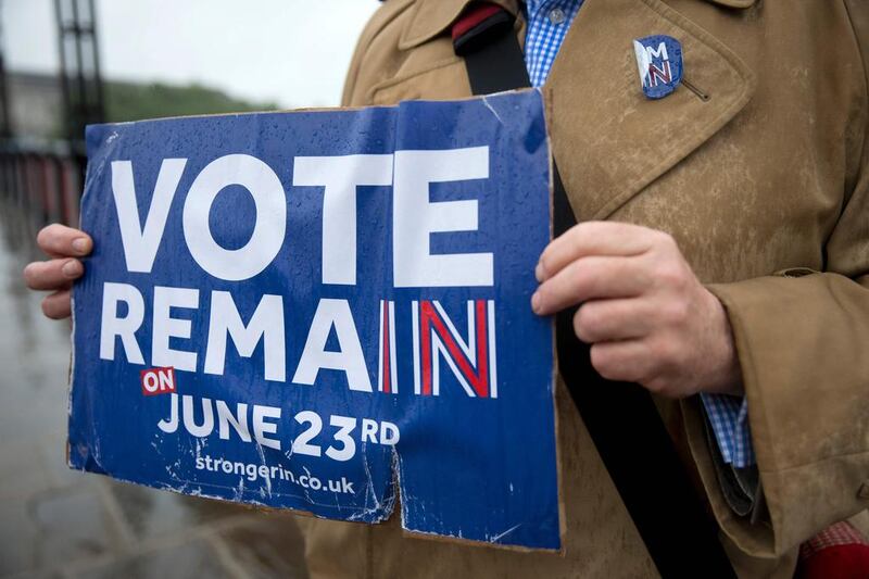 A campaigner holds a placard promoting the official remain case. Justin Tallis / AFP 