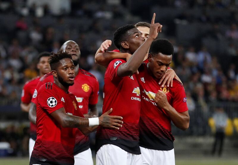 Pogba celebrates with Fred and Anthony Martial after scoring his and United's second goal. Action Images via Reuters