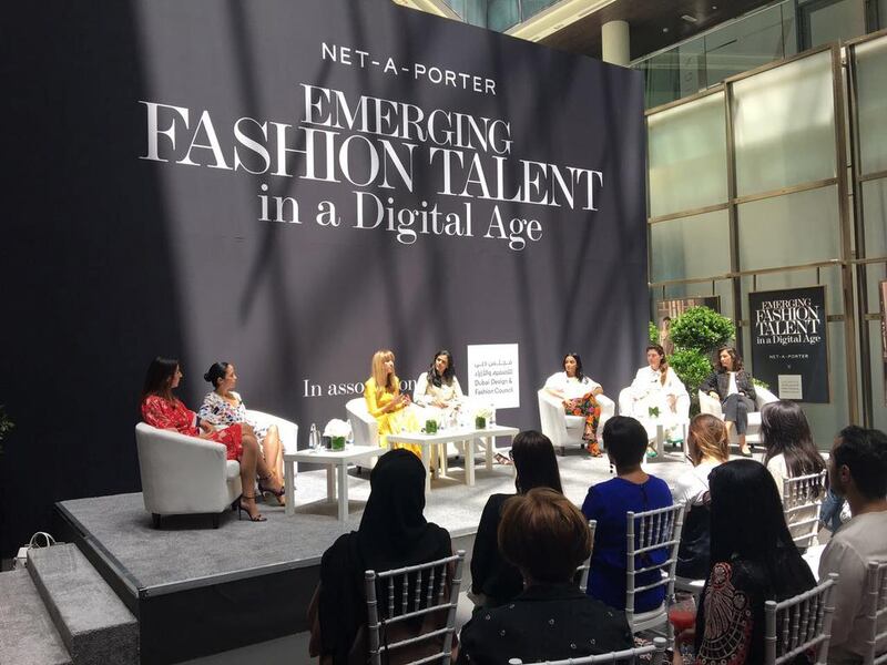 Lisa Aiken, in yellow, the retail fashion director at Net-a-porter at a talk in Dubai. Courtesy Net-a-porter