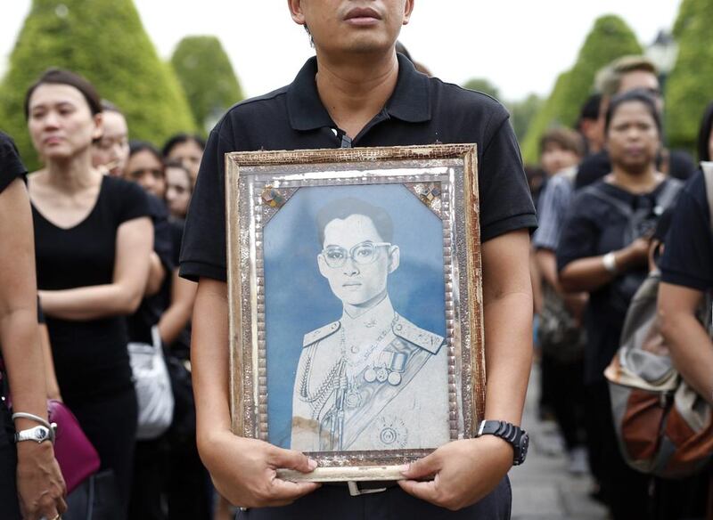 Thai mourners line up to sign condolence books to pay their respects to the late Thai King Bhumibol Adulyadej outside the Grand Palace in Bangkok. Rungroj Yongrit / EPA