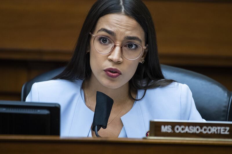 WASHINGTON, DC - AUGUST 24: Rep. Alexandria Ocasio-Cortez (D-NY) questions Postmaster General Louis DeJoy during a hearing before the House Oversight and Reform Committee on August 24, 2020 in Washington, DC. The committee is holding a hearing on "Protecting the Timely Delivery of Mail, Medicine, and Mail-in Ballots."   Tom Williams-Pool/Getty Images/AFP