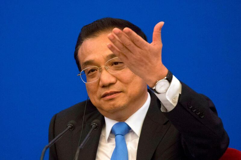 China's Premier Li Keqiang speaks during the China-EU Business Roundtable at the Great Hall of the People in Beijing on July 16, 2018. The European Union on July 16 called on the United States, China and Russia to work together to cool worsening global trade tensions, warning that they could spiral into violent "conflict and chaos." / AFP / POOL / Ng Han Guan
