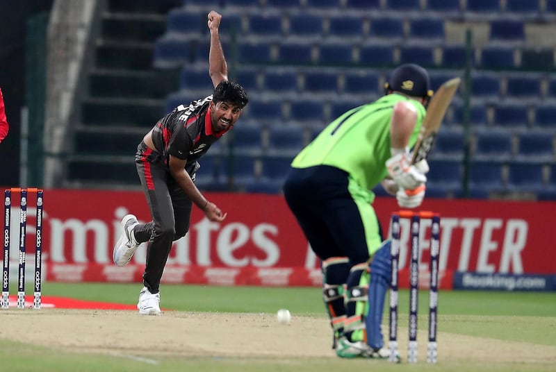 ABU DHABI , UNITED ARAB EMIRATES , October 19  – 2019 :- Junaid Siddique of UAE bowling during the World Cup T20 Qualifiers between UAE v Ireland held at Zayed Cricket Stadium in Abu Dhabi.  ( Pawan Singh / The National )  For Sports. Story by Amith