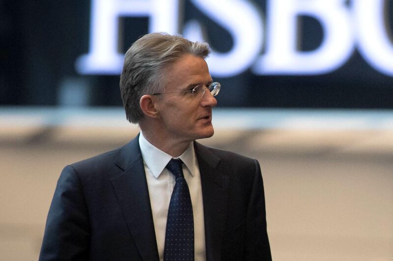 (FILES) In this file photo taken on March 07, 2018 Britain's Chancellor of the Exchequer Philip Hammond (out of frame) arrives to deliver a keynote speech on Brexit at HSBC headquarters at Canary Wharf in London on March 7, 2018 with HSBC CEO John Flint.  HSBC on August 5, 2019, said its Group Chief Executive John Flint had stepped down as the bank said it faces an "increasingly complex and challenging global environment". / AFP / POOL / Stefan Rousseau
