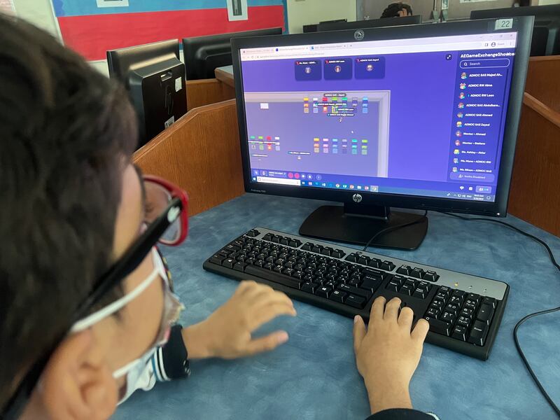 A pupil in the UAE uses a computer during the Games for Change Game Exchange. Photo: Games for Change