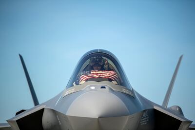FILE PHOTO: An F-35 pilot prepares for take off from the Vermont Air National Guard Base with the flag of the United States, before a flyover in South Burlington, Vermont, U.S. May 22, 2020. Picture taken May 22, 2020.  U.S. Air National Guard/Miss Julie M. Shea/Handout via REUTERS./File Photo