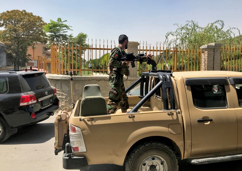 An Afghan soldier keeps watch on a street in Kabul.