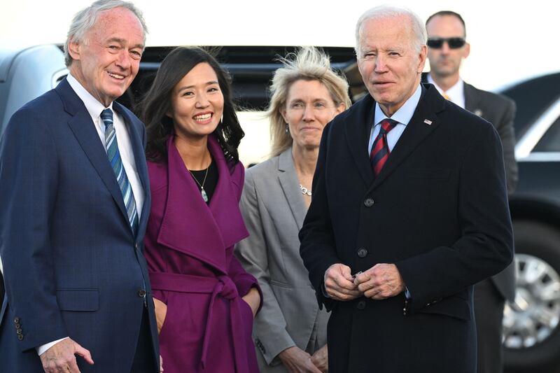 Mr Biden is greeted by Ed Markey, a Massachusetts senator, and Boston Mayor Michelle Wu on arrival at Boston Logan International Airport. AFP