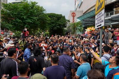 Demonstrators protest against Malaysia's newly sworn in prime minister, Muhyiddin Yassin, in Kuala Lumpur, Sunday, March 1, 2020. Mahathir Mohamad called Sunday for an urgent sitting of Malaysia's Parliament to contest the appointment of a former ally as prime minister under a Malay-majority coalition that could further split the nation following the collapse of Mahathir's multiracial reformist alliance. (AP Photo/Vincent Thian)