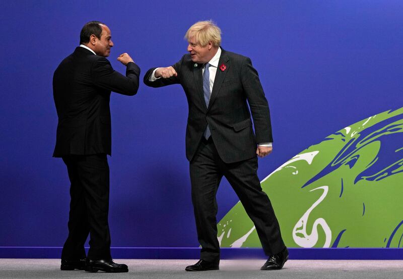 British Prime Minister Boris Johnson, right, greets Egyptian President Abdel Fattah El Sisi. AP