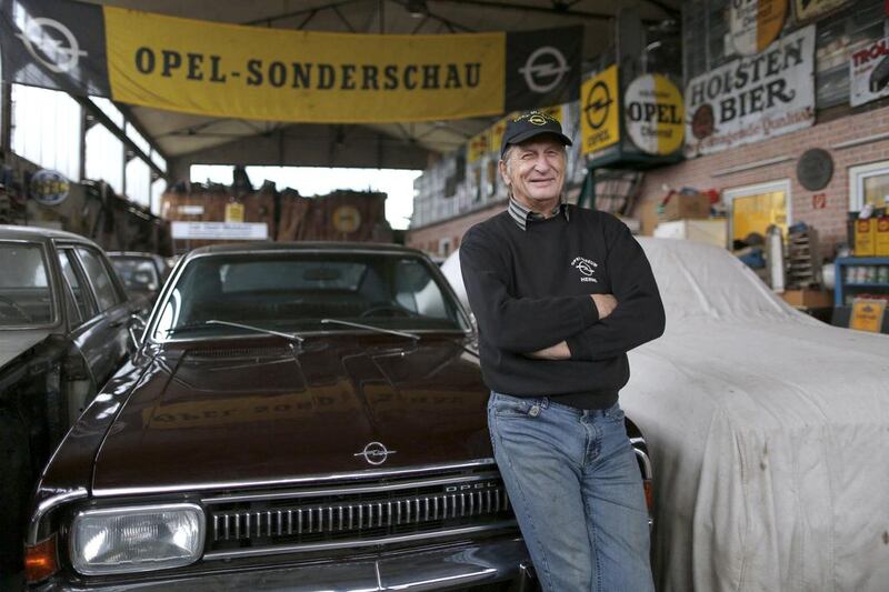 Hilmar Born, the owner of the Opel museum poses by a vintage Opel ‘Rekord’ car in Herne. Ina Fassbender / Reuters