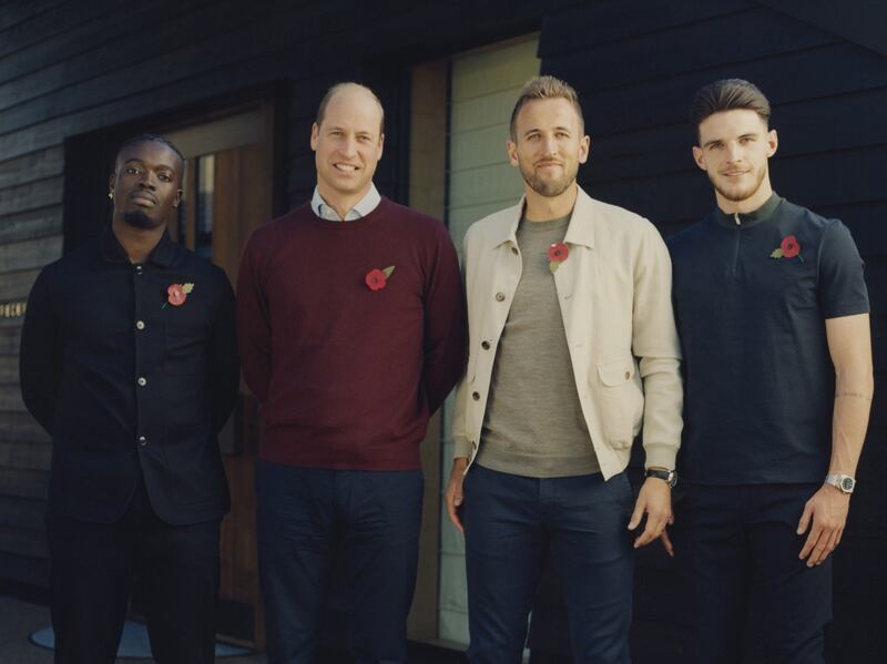 The Prince of Wales with host Kelvyn Quagraine, left, and footballers Harry Kane and Declan Rice, right. PA