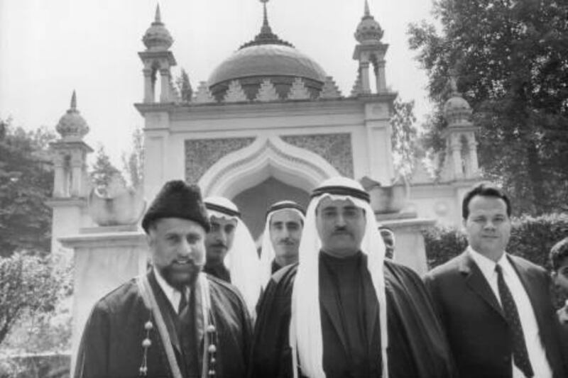 9th July 1968:  Sheikh Khalid bin Muhammad Al Qasimi, Ruler of Sharjah, with the Imam Misri (left) in front of the Shah Jehan Mosque in Woking, Surrey.  (Photo by Jim Gray/Keystone/Getty Images)