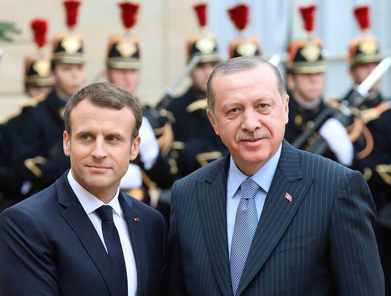 (FILES) In this file photo taken on January 05, 2018 French President Emmanuel Macron (L) welcomes his Turkish counterpart Recep Tayyip Erdogan upon his arrival for their meeting and luncheon at the Elysee palace in Paris.
Turkish President Recep Tayyip Erdogan on March 30, 2018 said he was "extremely saddened" by France's position after Paris offered to mediate with the Syrian Democratic Forces dominated by a Kurdish militia deemed a terrorist group by Ankara. "We are extremely saddened by France's... wrong stance on this issue," Erdogan said during a speech in Ankara after French President Emmanuel Macron said on Thursday that he hoped "a dialogue" could be established between Ankara and the SDF.
 / AFP PHOTO / LUDOVIC MARIN