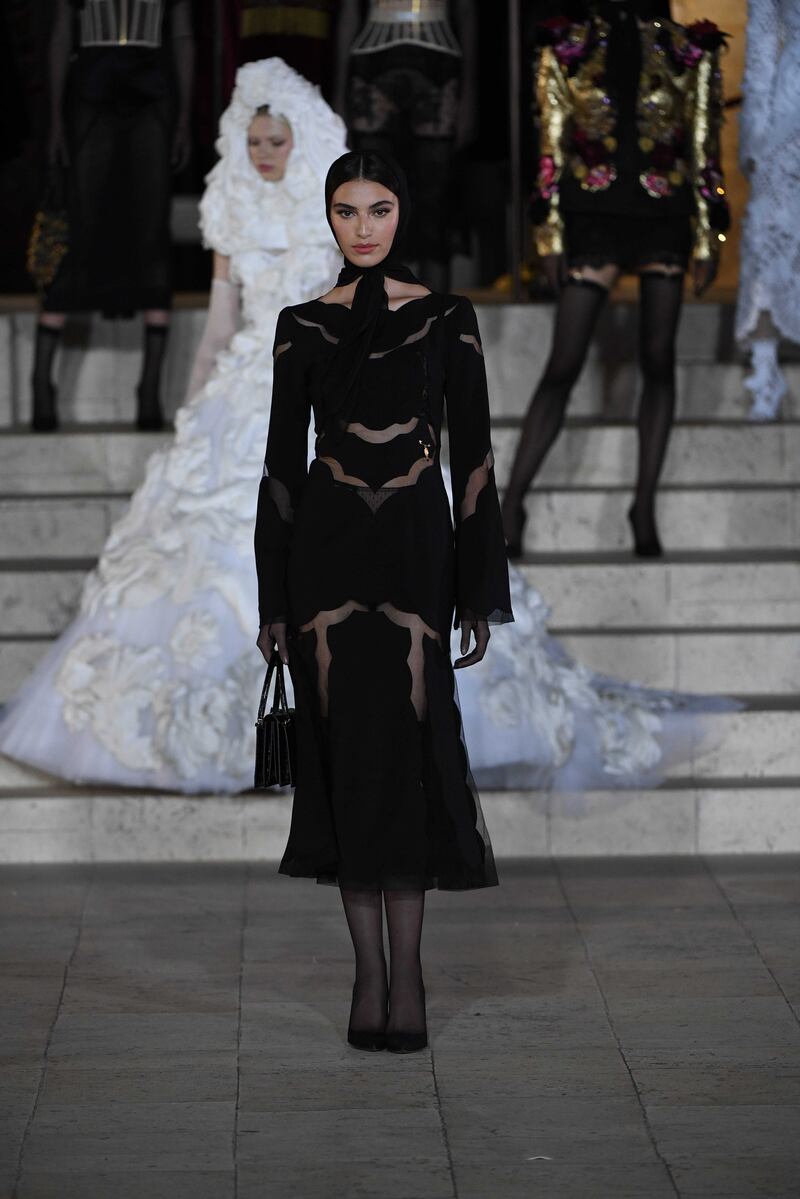 Saudi model Amira Al Zuhair walked the runway in a calf-length black dress.