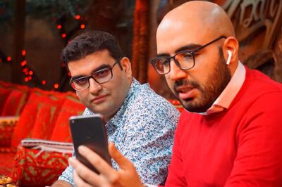 Certfa researchers Nariman Gharib, right, and Amin Sabeti speak to a colleague at a cafe in London on Friday, Dec. 7, 2018. The Associated Press drew on data gathered by the London-based cybersecurity group Certfa to track how a hacking group often nicknamed Charming Kitten spent the past month trying to break into the private emails of more than a dozen U.S. Treasury officials. Also on the hackersâ€™ hit list: high-profile defenders, detractors and enforcers of the nuclear deal struck between Washington and Tehran, as well as Arab atomic scientists, Iranian civil society figures and D.C. think tank employees. (AP Photo/Raphael Satter)