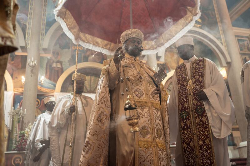 An Ethiopian Orthodox priest spreads incense while conducting a church service during the celebration of Easter at the Bole Medhanialem Church in Addis Ababa. AFP