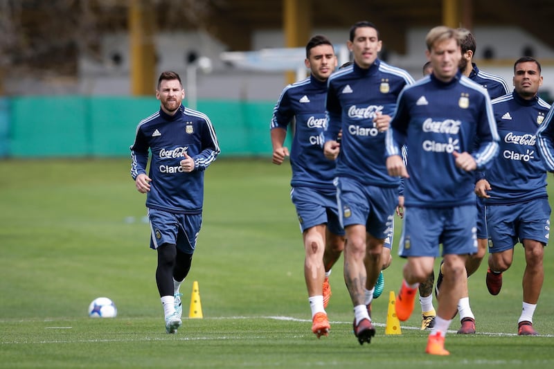 Argentina's Lionel Messi, left, trains with the team for a 2018 Russia World Cup qualifying soccer match against Peru, in Buenos Aires, Argentina, Tuesday, Oct. 3, 2017. (AP Photo/Victor R. Caivano)