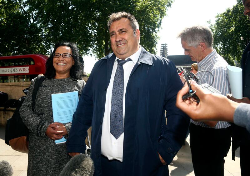 Former Pimlico Plumbers employee Gary Smith leaves the UK Supreme Court, Parliament Square, London, Wednesday, June 13, 2018. A London plumber who claimed he was unfairly dismissed after years of working as a contractor has won a court ruling giving him employment rights, in a case seen as a key test of labor rules in the so-called gig economy. Britainâ€™s Supreme Court upheld a ruling by a lower court saying that Gary Smith, who worked for Pimlico Plumbers full-time for six years, was entitled to rights such as sick pay. (Yui Mok/PA via AP)