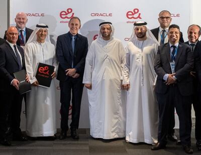 Top executives from e& and Oracle during the signing ceremony at the latter's CloudWorld forum in Abu Dhabi on Wednesday. Photo: Oracle