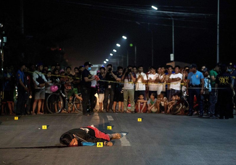 The body of a man killed by an unidentified gunman lies on a street in Manila, Philippines on February 17, 2017. Noel Celis / Agence France-Presse 
