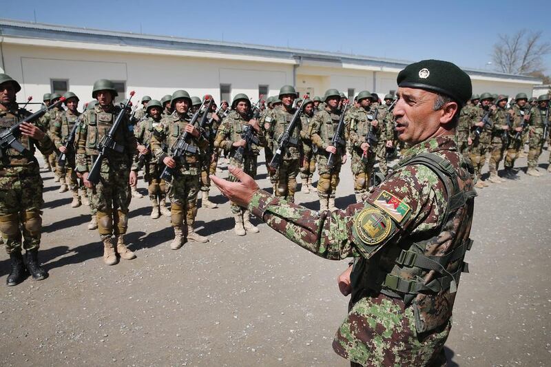 Soldiers with the Afghan National Army (ANA) graduate from basic training during a ceremony at the ANA’s combined fielding centre in Kabul. Scott Olson / Getty / March 18, 2014