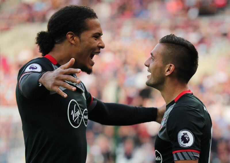 Southampton’s Dusan Tadic celebrates scoring their second goal with Virgil van Dijk. Eddie Keogh / Reuters