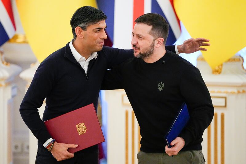 Britain's Prime Minister Rishi Sunak, left, greets Ukrainian President Volodymyr Zelenskyy in Kyiv, Ukraine. AP