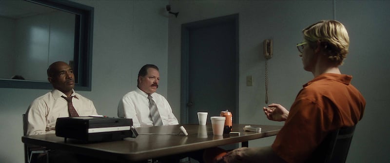 From left, Michael Beach as detective Murphy, Colby French as detective Kennedy, with Evan Peters as Jeffrey Dahmer.
