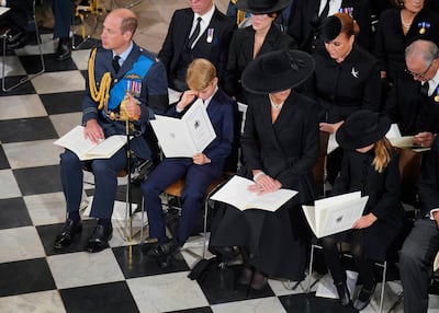 From left, Prince William, Prince George, Catherine, Princess of Wales and Princess Charlotte sit at the funeral service of Queen Elizabeth II at Westminster Abbey on Monday. AP