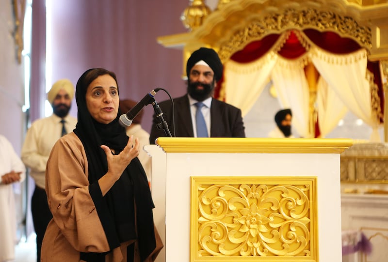 DUBAI , UNITED ARAB EMIRATES – Oct 5 , 2016 : Sheikha Lubna Bint Khalid Bin Sultan Al Qasimi , Minister of State for Tolerance , UAE ( left ) speaking during her visit at the GuruNanak Darbar Gurudwara at Jebel Ali in Dubai. Also seen in the photo Surender Singh Kandhari , Chairman , GuruNanak Darbar Gurudwara ( center ). ( Pawan Singh / The National ) For Standalone. ID No  - 67708 *** Local Caption ***  PS0510- GURUDWARA06.jpg