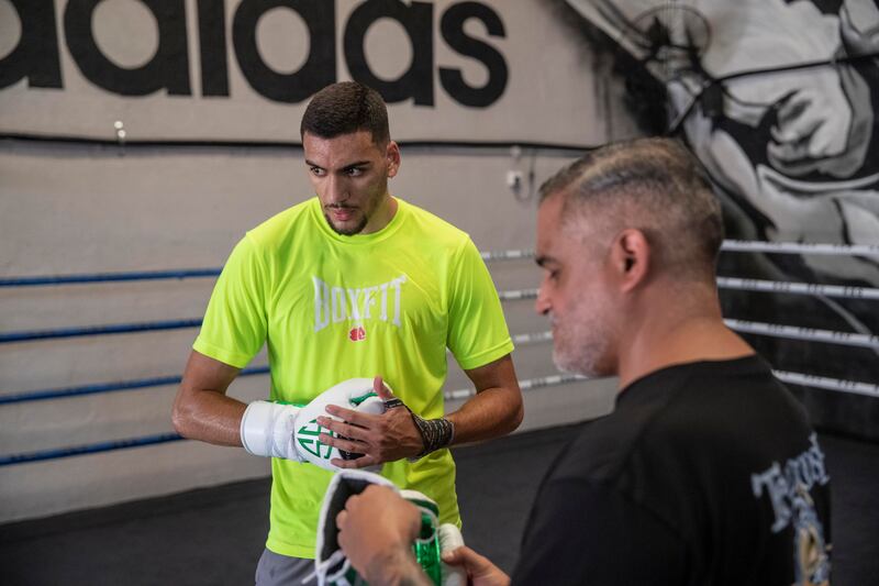 Hamzah Sheeraz with trainer Ricky Funez at the Real Boxing Only Gym. Antonie Robertson / The National